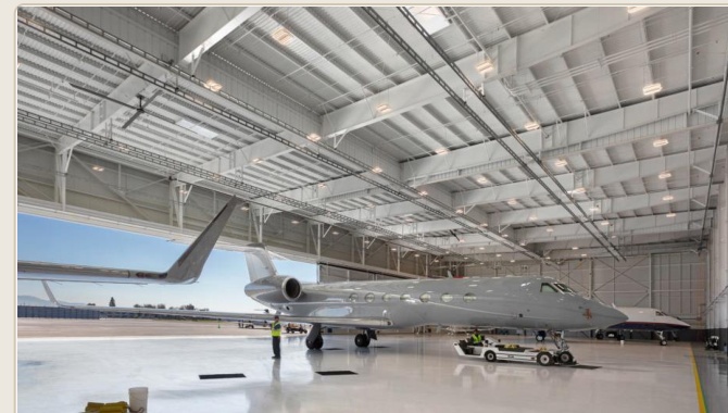 Business aircraft inside hangar