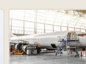 Aircraft undergoing maintenance in hangar